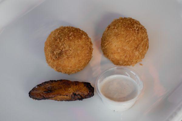 Potato Balls.  Mashed Balls of Potato with Center filled with Seasoned Ground Beef and Cheese.  Then Rolled in Egg, Panko and deep fried.