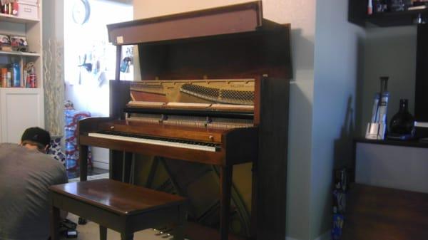 Piano delivered and is being tuned and adjusted...