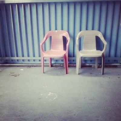 on the outside they kept two of the old plastic chairs before the renovation, took pictures of this nostalgic moment. Ha!