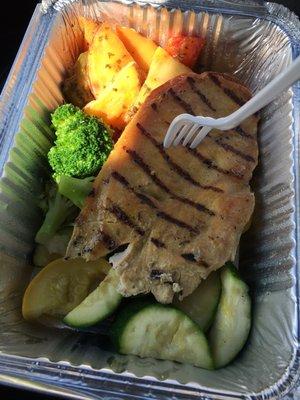 Grilled chicken,baked potatoes with peppers, and mixed vegetables