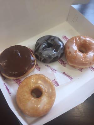 Clockwise from bottom: cronut, Bavarian cream, chocolate cake glazed, regular glazed