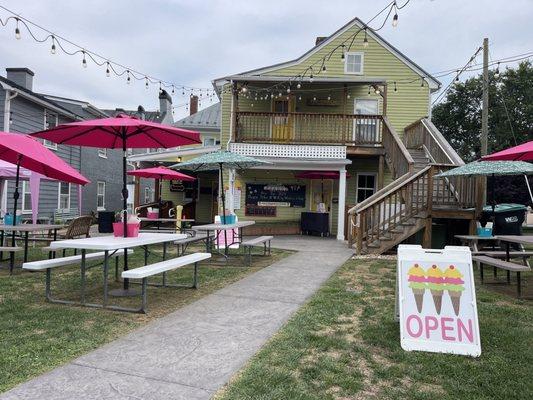 Back area of the building and outdoor seating.