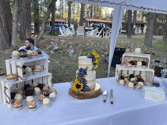 Desert table with cabins and fire pit area in the background.