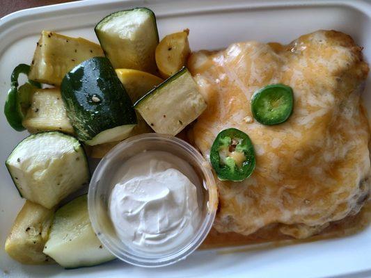 Chicken enchilada with summer squash and zucchini and some sour cream