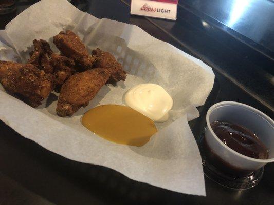 Chicken wings with the pub rub, ranch, honey mustard, and BBQ sauce.