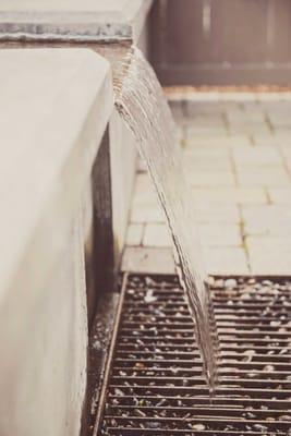 Subtle Concrete + Steel Weir Water Feature