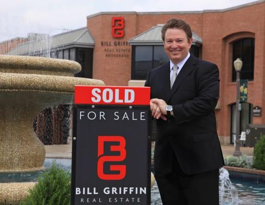 Bill Griffin at the Snider Plaza Fountain in front of Bill Griffin Real Estate.