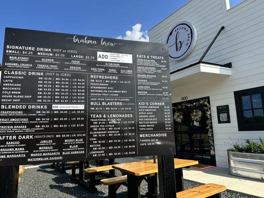 Menu and view of front of business from drive thru.