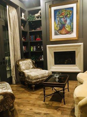 Library...accessorize book shelves and fine art with reupholstered French chairs and custom silk drapery.