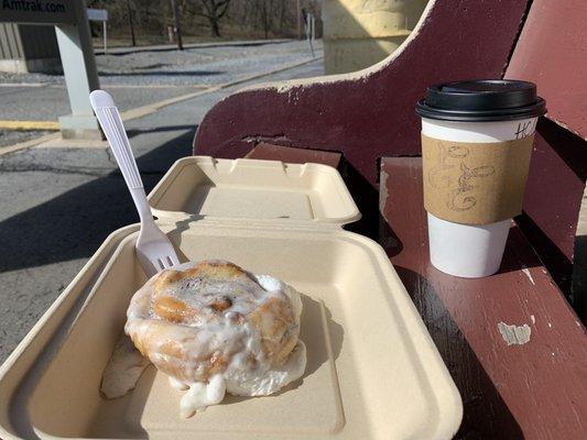 Hot chocolate and warm cinnamon roll to go