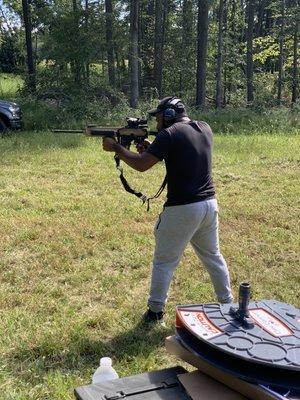 In the series of pictures of this young is shooting an AR 15 for the first time 
He is shooting a HK MR555A1