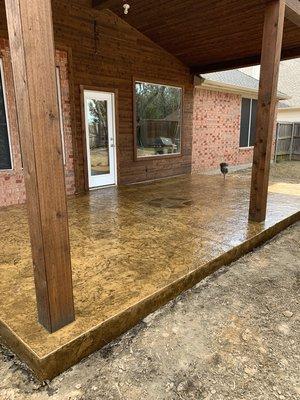 Gorgeous patio extension with a Texas Star stamped and stained in the center!