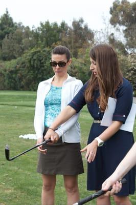 Checking out the grip! Making sure the ladies learn the proper technique from the get go!