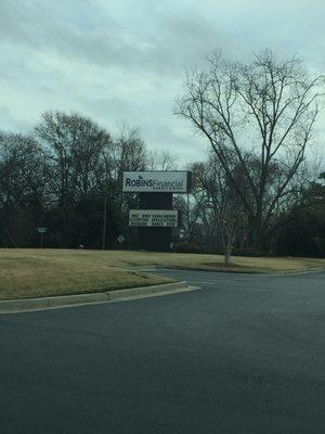 Sign in front of building