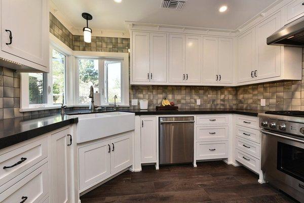 Custom Inset-Door Kitchen with a Farmhouse Sink Base at a 45 degree angle.