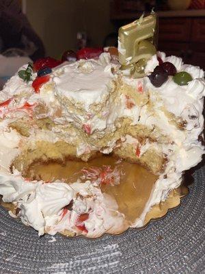 Overflowing whipped cream in "Tres Leches" cake.