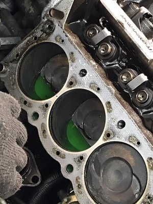 Result of an overheated motor and damaged cylinder head gasket.