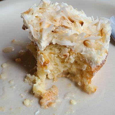 Close-up of Bien me sabe dessert. It's like a Tres Leche  with coconut on top.