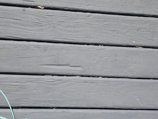 Damaged wood on deck that was painted