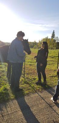 Steven and Alex with horse that ran over while on a walk.