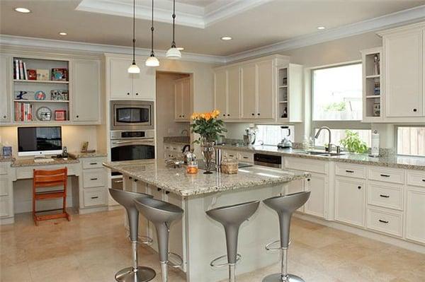 This bright & airy kitchen has light granite island & counters but would be equally gorgeous in light to dark gray counters.