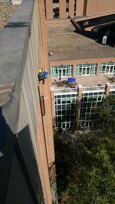 Rope Access being used to change dryer vent covers