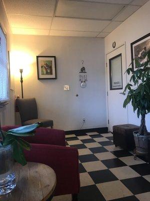 Another side of the waiting room, and a door to where one of the doctor's' offices is.