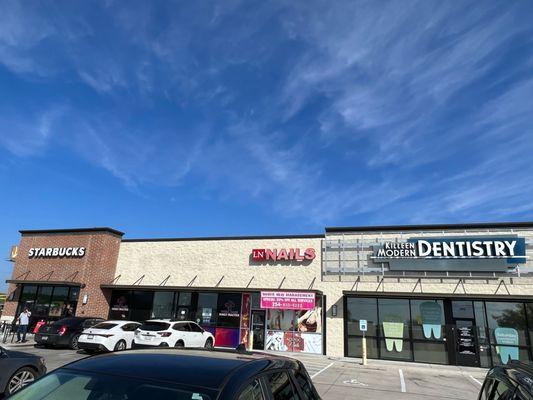 Plenty of parking front and back, next to Starbucks and Dental