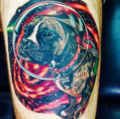 Thigh ink by JRock, of our dog in space