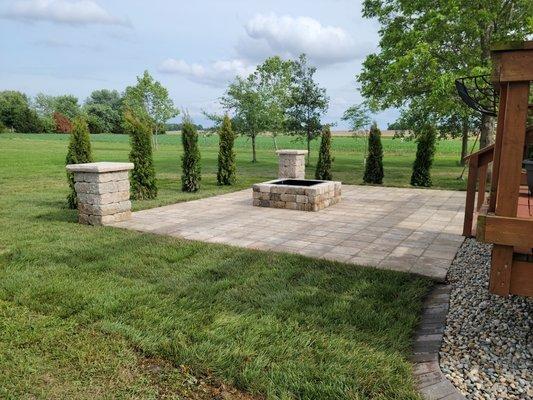 This is a 15x15 patio with block columns and fire pit.