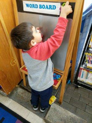 My son enjoying the word board.