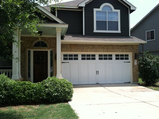 Clopay Coachman Series insulated garage door w/obscure glass windows.