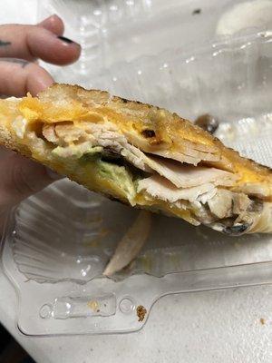 Sorry I took a bite before the photo! Turkey melt with avo/mushrooms & extra cheese!