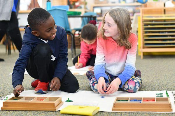 West Side Montessori students working with math materials.