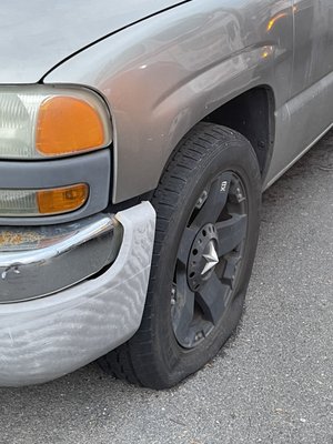 Slashed front left tire