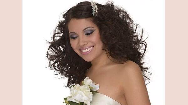 Voluminous hairstyle with elegant hair accessory for special occasion . Hair and makeup by Kerry-Lou