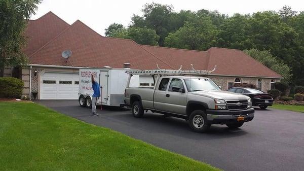 Power washing siding, pool deck, retaining walls and gutter cleaning at this house.