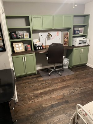 Custom built office with hardwood floor, trim and paint.