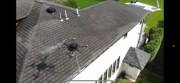 Drone-Powered roof cleaning. No more worries about people falling off of your room or damaging shingles.