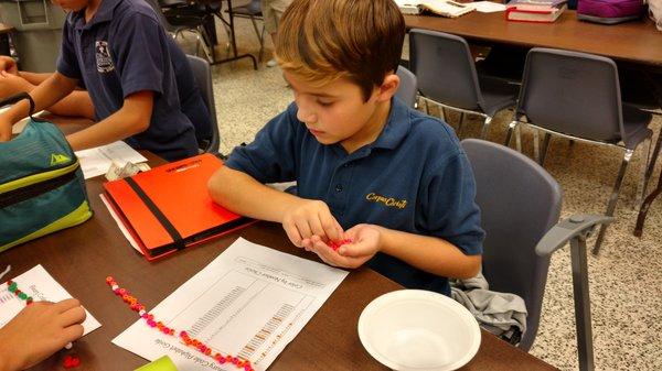 Our STEAM club spelled out their names using Binary Code (and made necklaces)!