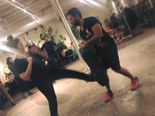 Me trying to kick! At a self defense workshop that was held at seventh son.