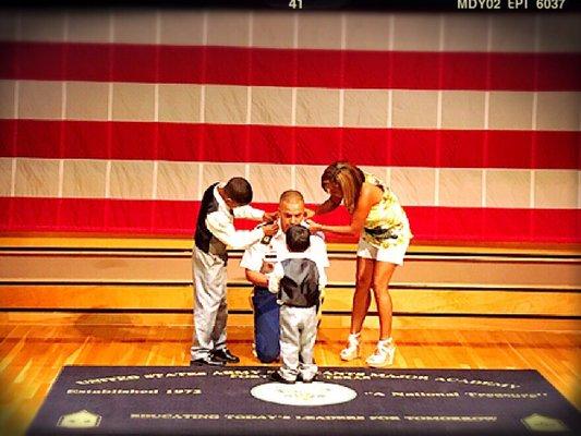 During a formal ceremony, Raymond J. Belk gets pinned CSM (Command Sergeants Major) at the USASMA by his two sons and wife.