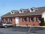 We are located at the lower level on the back side of this building, conveniently located off 147 - S. River Road