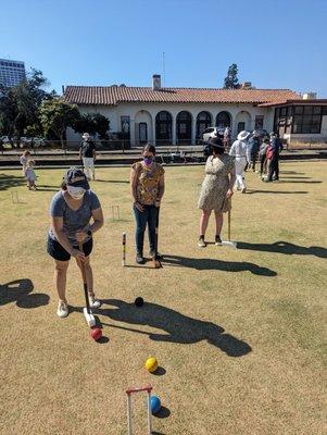 First-timers playing croquet as part of a meet & greet group outing