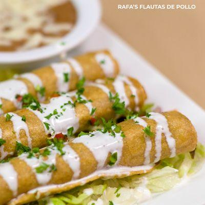 Pan fried flautas served on a bed of lettuce with sour cream, guacamole , pico de gallo , Mexican rice and refried beans. #flautas