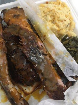 Ribs and chicken with macaroni and cheese and greens