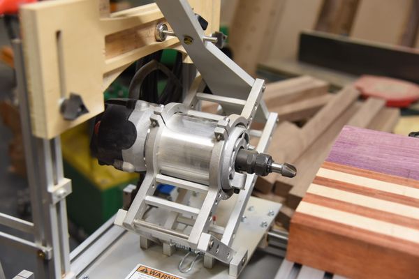 Making a finger holder using Pantorouter machine, a horizontal router with a custom made template.