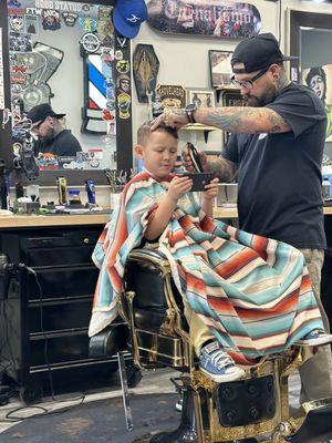 Andy cutting my sons hair