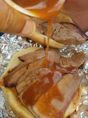 Brisket sandwich gettin' sauced!