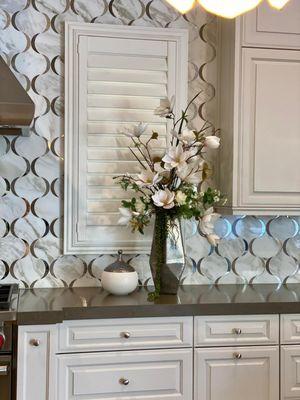 Magnolia Flower arrangement with tall silver vase